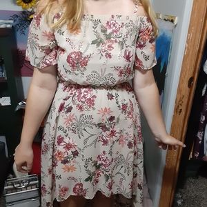 A dress. Short in front. Flowy in back. Medium
